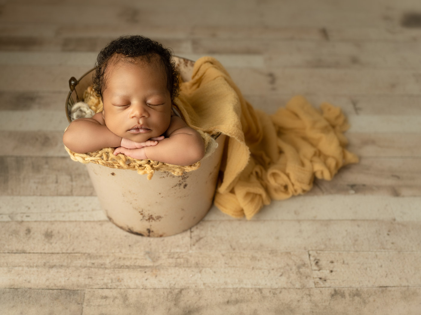 Sleeping newborn wrapped for a studio portrait session in Durham Region