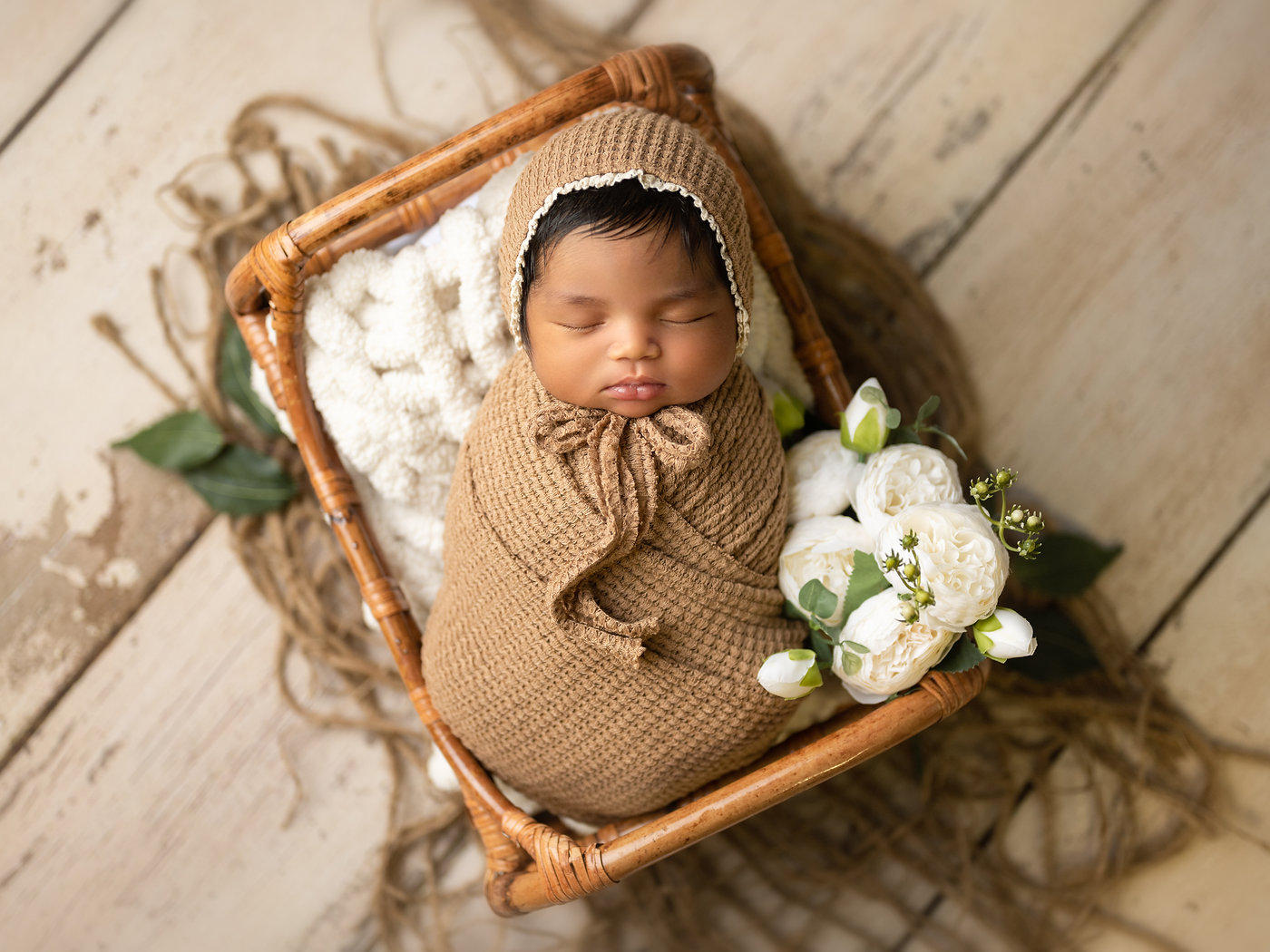 Newborn baby portrait in soft neutral tones